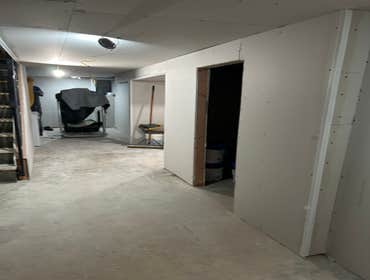 Photos by Your Expendable Services LLC #1 Basement remodeling project completed with new framework, walls placed and painted. New recess lights and LPV