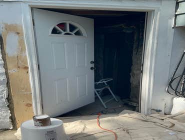 Photos by Proper Contracting Ny Inc #2 Take out old door. Replace new metal door.
