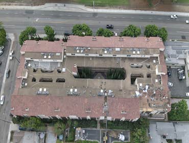 Large HOA- Foam & Tile Re roof. Long Beach, CA