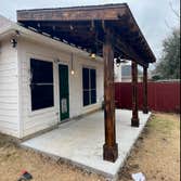 covered patio 3 posts burned and stained, heavy and tall, custom covered patio with sound wall