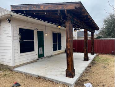 covered patio 3 posts burned and stained, heavy and tall, custom covered patio with sound wall
