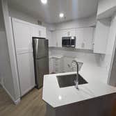 Apartment Renovation Unit Renovation including electrical and plumbing upgrades, tub replacement, new cabinets and counters, new flooring, full paint, 