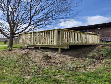 Deck Build by Alzaria Construction LLC We took old deck out and built a new pressure treated deck with composite deck floor boards.