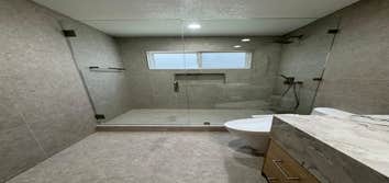 Bathroom & Laundry room remodeling This high-end bathroom and laundry room remodel in San Jose features custom-built cabinetry, designer tile work, mod