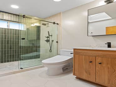 Mid Century Kitchen & Bath A full home transformation blending warmth and modern elegance.
The kitchen was completely reimagined from its dated layout 
