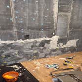 Photos by Strong Innovative Structures Inc #3 Interior renovation including cement board installation, full-height feature wall tile installation, and 