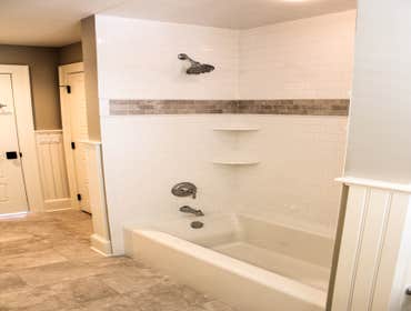 Baine Contracting Inc Project Multiple jobsites - showing kitchens, interior and exterior trim work, new homes, bathrooms, tile work, wood and iron ra