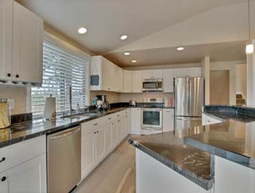 Full Kitchen Remodel new cabinets, granite countertops, new appliances, lighting, laminate flooring and millwork.