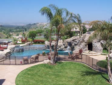 Photo(s) from CUSTOM DERIAN POOLS Infinity Pools, Hillside Pools, Landscaping, BBQs, Outdoor Fireplaces, Shade structures, Pergolas, Landscaping, Mason