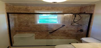 Tub to Shower done right - Greenville Pa. We removed a 54" tub with a center drain, the scabbed in plumbing wall, the bad tile job and the bad vinyl wi