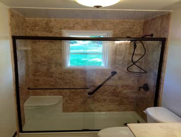 Tub to Shower done right - Greenville Pa. We removed a 54" tub with a center drain, the scabbed in plumbing wall, the bad tile job and the bad vinyl wi