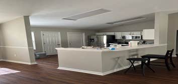 Photos by Tropical Building & Remodeling Inc #1 Completely removed old kitchen and end pony wall. Cut down pony wall to cabinet height and installed ro