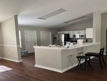 Photos by Tropical Building & Remodeling Inc #1 Completely removed old kitchen and end pony wall. Cut down pony wall to cabinet height and installed ro