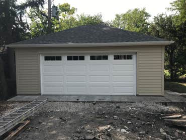 Photos by A-Windy City Garage Corporation #4 New garage construction hip roof and hardie siding.