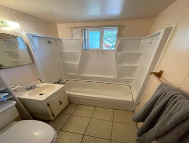 Photos by Triple A LLC #1 Complete bathroom remodel, removal of flooring and old shower and tub.