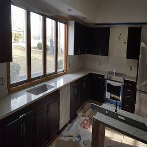 Photos by Ez Construction #1 Installation of custom cut tile for backsplash