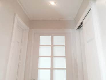 Upper West Side Our work for this project included full gut renovation with exposed brick wall, Calacatta countertop, and glass shower. Bathroom with c