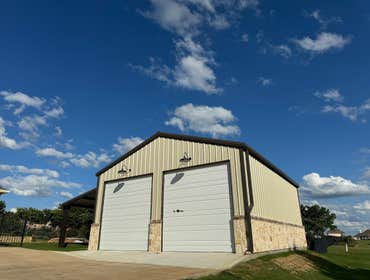 30X36 Metal Garage with Stone Veneer Wainscot