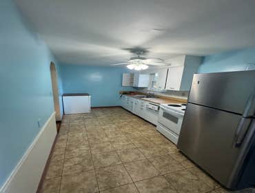 Photos by Excelsior Home Improvement #4 Replace all existing kitchen cabinets, countertops, appliances, paint walls, install new flooring , electrical 