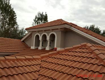 Photos from Popa Construction LLC Before & Afters of a soft wash roof cleaning and driveway and side walk cleaning.