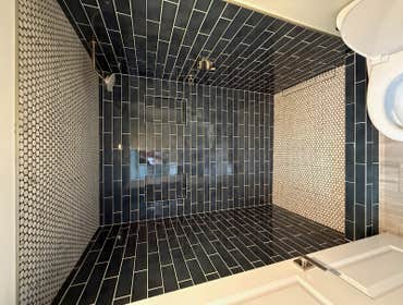 Photos by Purflo plumbing LLC #1 Custom 3’x5 subway tiled shower with mitered joints
