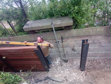Photos by Tonka Ground Work #3 Soldier pile retaining wall to replace failing old wall.