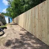Photos by Kelly Solutions Construction LLC #4 New 8ft privacy fence with concrete footer and chain link security fence. Commercial