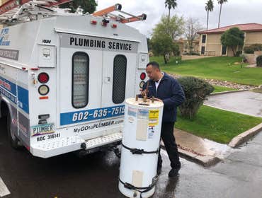 Old water heater being hauled away