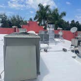 Photos by Southern Roofing & Repairs LLC #3 Cleaned prepped and applied 2 coats of 20 year-100% waterproof silicone roof coating, filled in all low spo