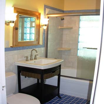 Pretty bathroom Blue glass block window,with glass tile floor