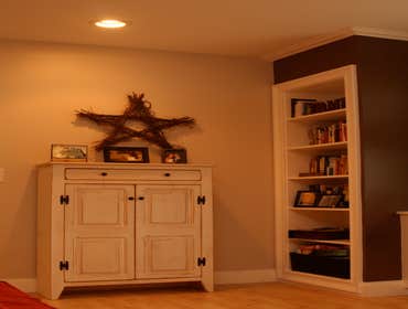 Shaughnessy Custom Trimwork- columns and Beadboard. Built in bookshelves, radiator covers and entertainment area.