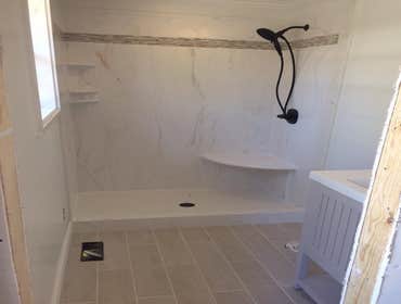 Photos by North Alabama Remodeling Co. LLC #2 Cultured marble showers with tile feature inlays in custom designed bathroom remodels