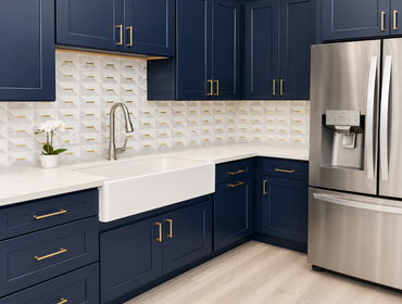 Kitchen Remodel This custom kitchen remodel features elegant navy blue shaker cabinetry paired with brushed brass hardware for a timeless, upscale look