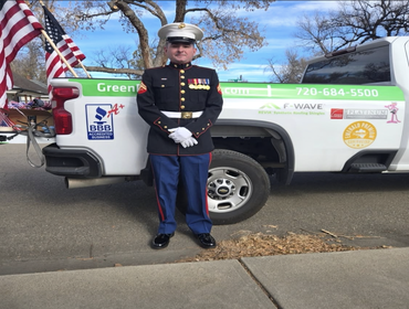 GreenPoint Roofing's Project Manager Jason Baker, US Marine Corps veteran at the Longmont Veteran's Day Parade