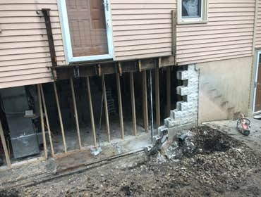 Photos by Excavo Construction Co #9 Demolition cement block walls, build new wall and waterproofing