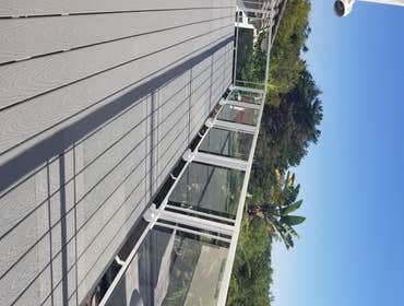 Photos by Remo Construction #4 Balcony deck , TREX flooring( Pebble Gray) and aluminium and glass railings.