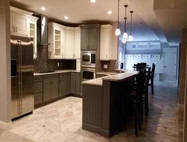 Finished Lower Level Complete finished basement, Includes full kitchen, cocktail area, locker area for pool, full bath, barn door covering utilities, c