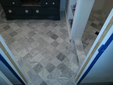 Marble floor Marble floor set on a diagonal with heating element installed underneath.