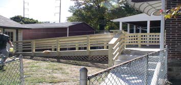 Handicap Ramp Project required the removal of an existing ramp and railing which than was replaced with the construction of a new ramp and railing. Als