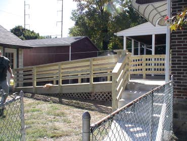 Handicap Ramp Project required the removal of an existing ramp and railing which than was replaced with the construction of a new ramp and railing. Als