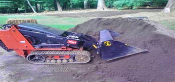 Photos from Backyard Backup Services Llc Here are some shots of a Toro Dingo 427 wide track with different attachments. This machine gives me the abil