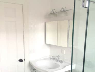 Upper West Side Our work for this project included full gut renovation with exposed brick wall, Calacatta countertop, and glass shower. Bathroom with c