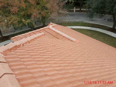 Photos from Popa Construction LLC Before & Afters of a soft wash roof cleaning and driveway and side walk cleaning.