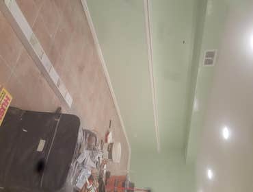 Photos from Savala Construction, Inc. Removed drywall with mole, new drywall installed,plaster, also painting. 6 more lectril can lights.