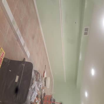 Photos from Savala Construction, Inc. Removed drywall with mole, new drywall installed,plaster, also painting. 6 more lectril can lights.