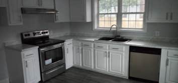 Photos by Insight Builders and Consultants, LLC #2 Kitchen on a tight budget. Used cabinets, used appliances, used composite granite sink and fixture.