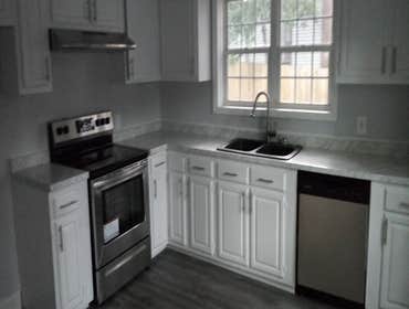 Photos by Insight Builders and Consultants, LLC #2 Kitchen on a tight budget. Used cabinets, used appliances, used composite granite sink and fixture.