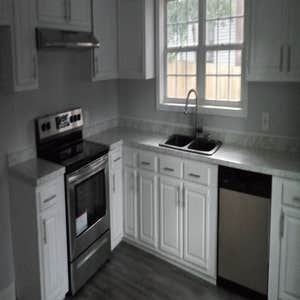 Photos by Insight Builders and Consultants, LLC #2 Kitchen on a tight budget. Used cabinets, used appliances, used composite granite sink and fixture.