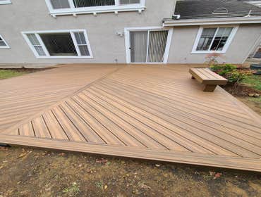 New Deck Construction Client wanted to redo his backyard, so we put in a new walkway and a deck.