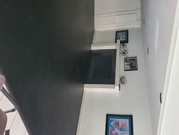Raised sunken living room with hardwood floor